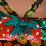 Colorful sandal with a decorative strawberry on toe strap detail