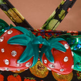 Colorful sandal with a decorative strawberry on toe strap detail