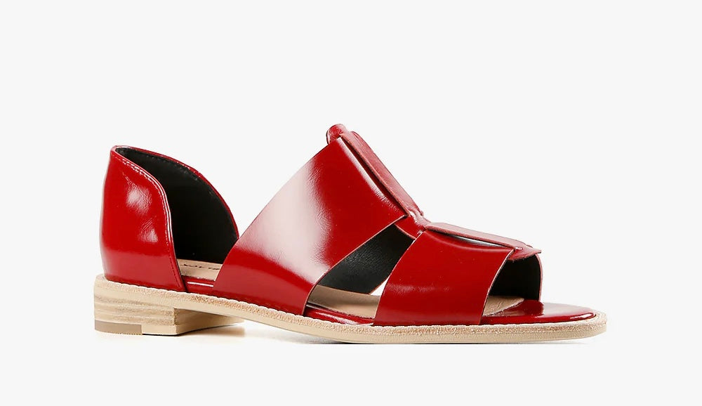Red sandal with beige sole close-up