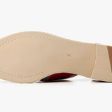 Red sandal with beige sole sole view