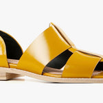 Yellow sandal with beige sole close-up