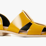 Yellow sandal with beige sole close-up
