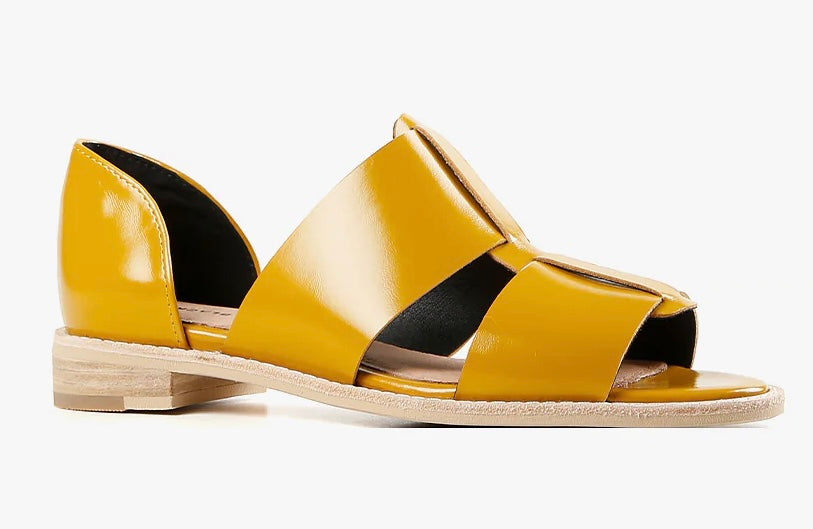 Yellow sandal with beige sole close-up