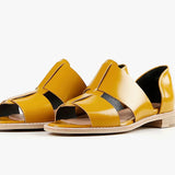 Yellow sandal with beige sole pair front view