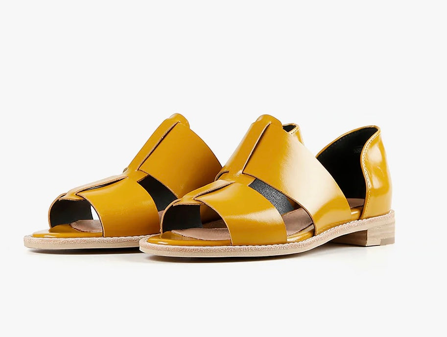 Yellow sandal with beige sole pair front view