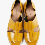 Yellow sandal with beige sole top view