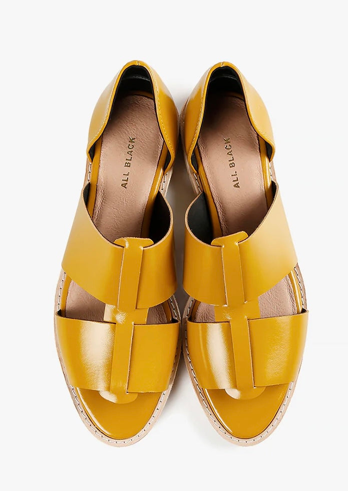 Yellow sandal with beige sole top view
