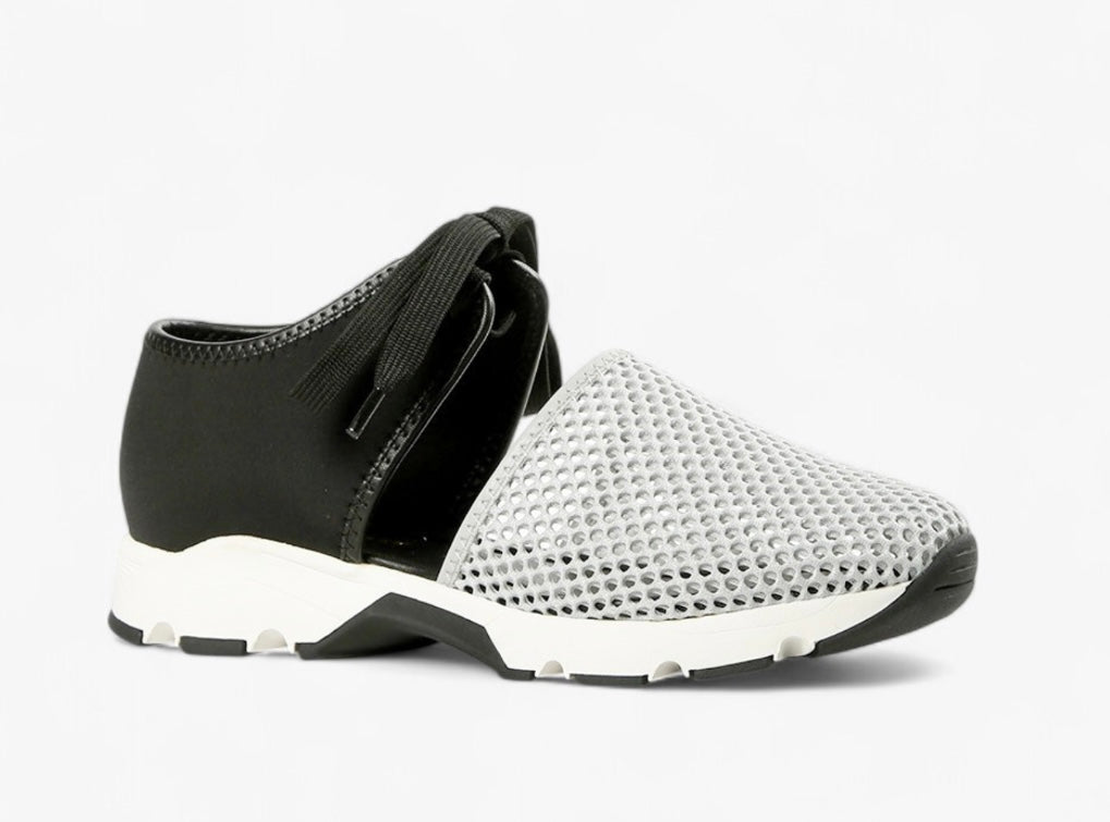 Black sneaker with gray mesh toe box with a white sole close-up
