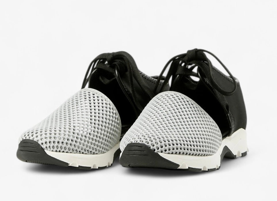 Black sneaker with gray mesh toe box with a white sole pair