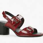 Red heel with decorative straps block block heel and buckle closure close-up