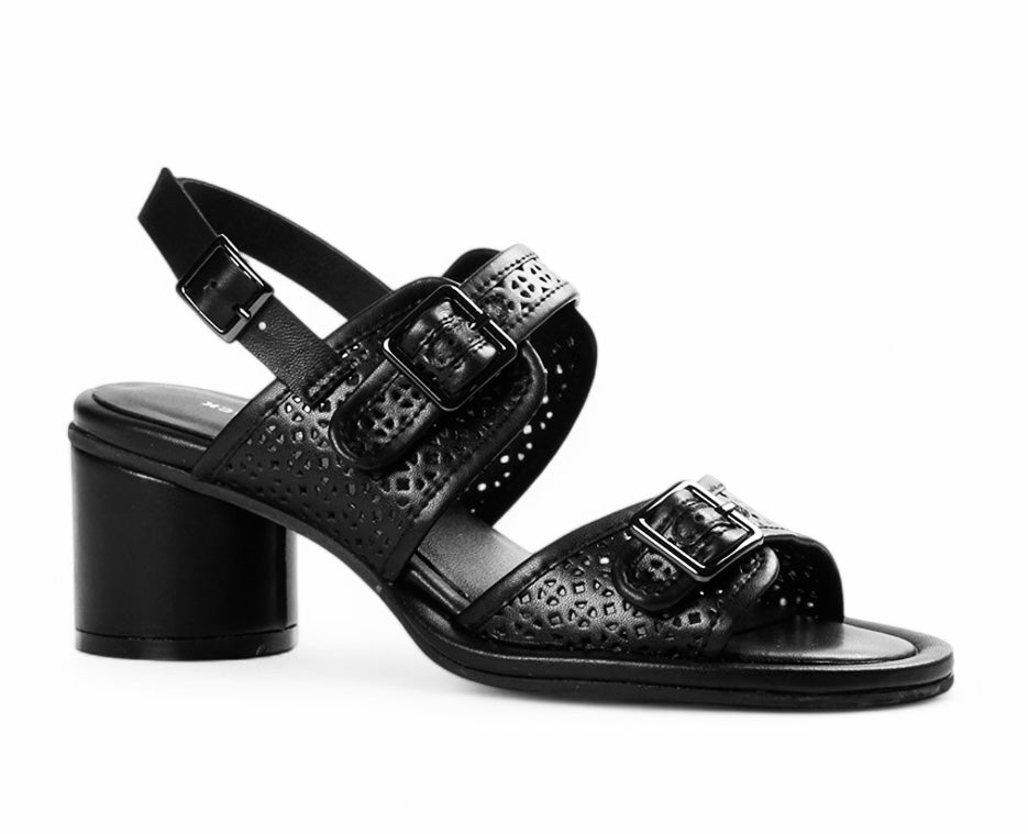Black heel with decorative straps and buckle closure close-up
