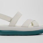 White platform sandal with a blue-green sole and multiple straps close up