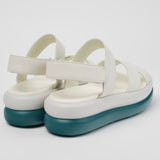 White platform sandal with a blue-green sole and multiple straps pair from back