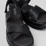 Black platform sandal with a thick sole and multiple straps pair