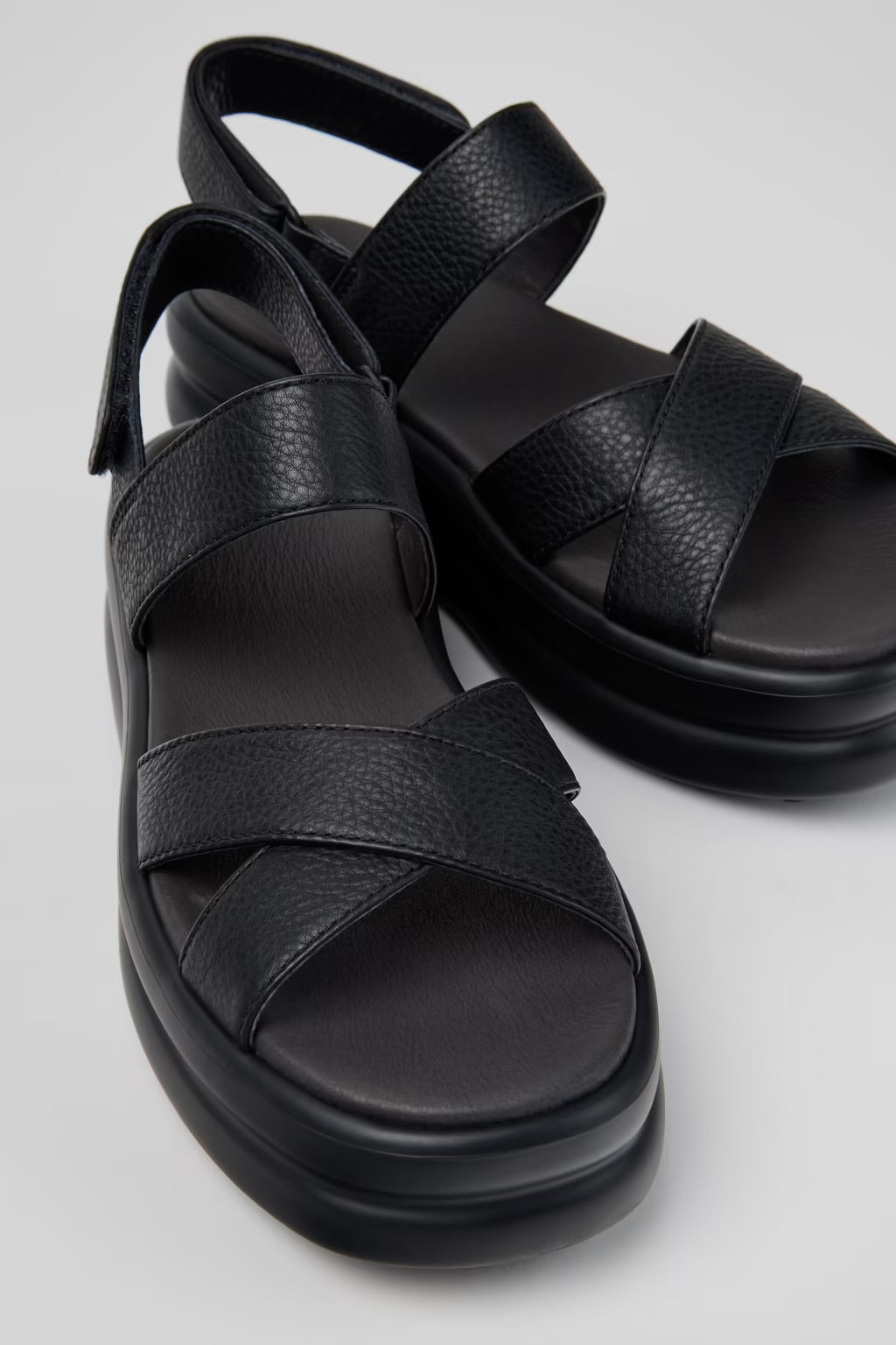 Black platform sandal with a thick sole and multiple straps pair