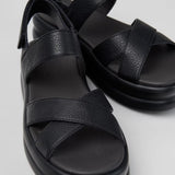 Black platform sandal with a thick sole and multiple straps pair
