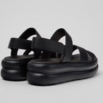 Black platform sandal with a thick sole and multiple straps pair from back