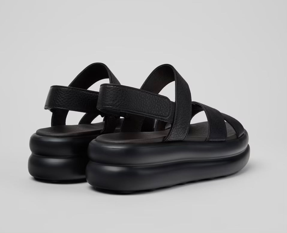 Black platform sandal with a thick sole and multiple straps pair from back