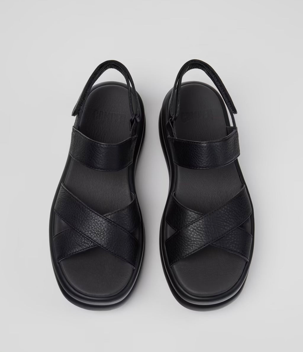 Black platform sandal with a thick sole and multiple straps pair from top