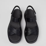 Black platform sandal with a thick sole and multiple straps pair from top