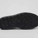 Black platform sandal with a thick sole and multiple straps bottom