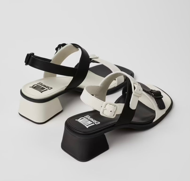 Black and white modern sandal with a block heel and buckle straps pair from back