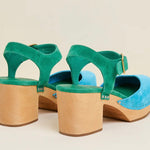 Green and blue suede shoe with golden buckle and wooden heel pair from back