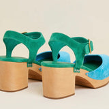 Green and blue suede shoe with golden buckle and wooden heel pair from back