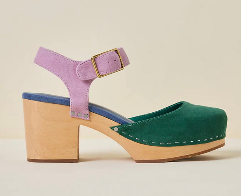 Green and blue suede clog shoe with pink strap with gold strap, and wooden sole close up