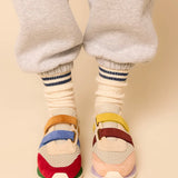 Multicolored velcro sneaker pair