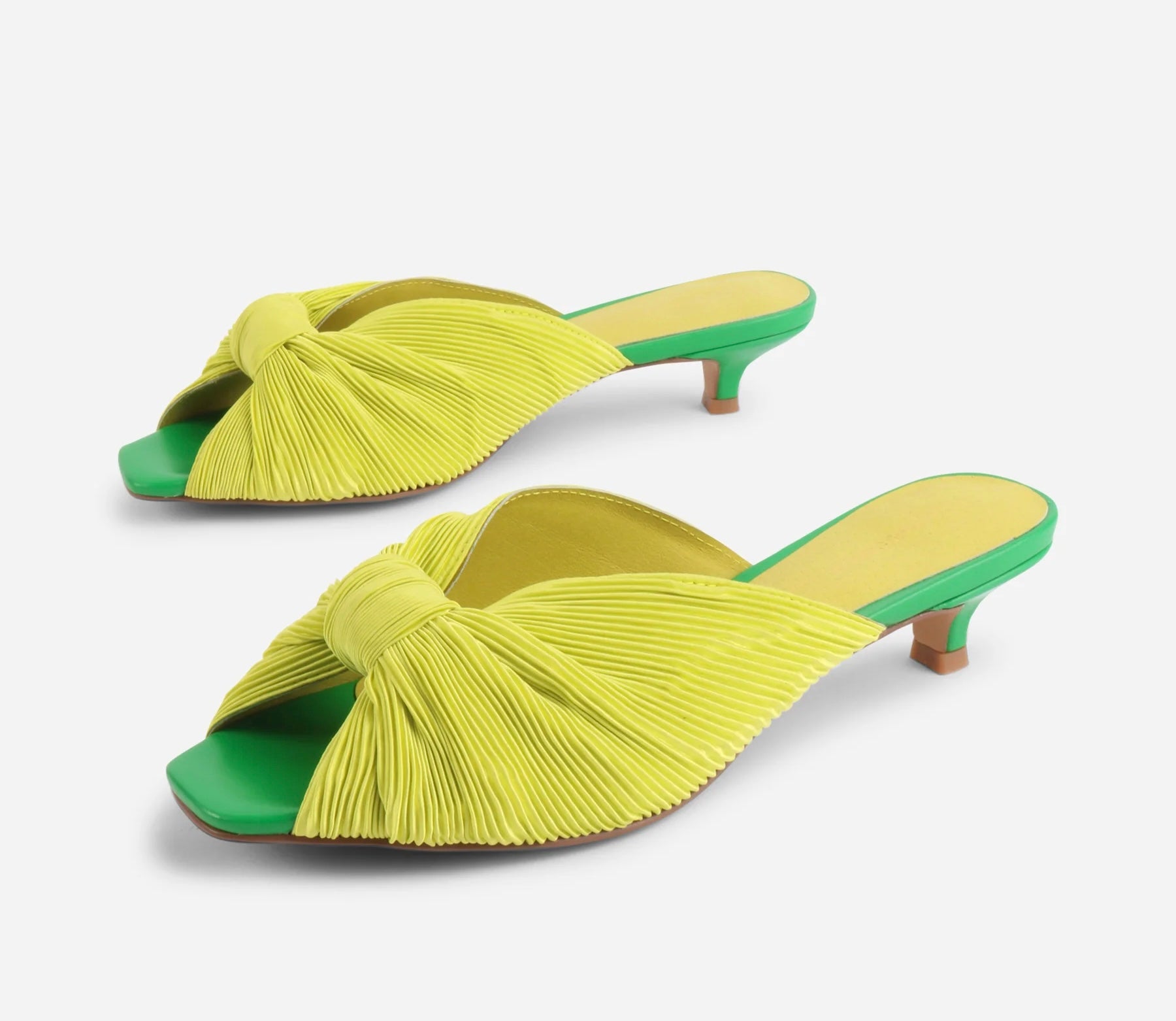 Yellow pleated kitten pen back sandal with a green heel pair 