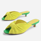 Yellow pleated kitten pen back sandal with a green heel pair 