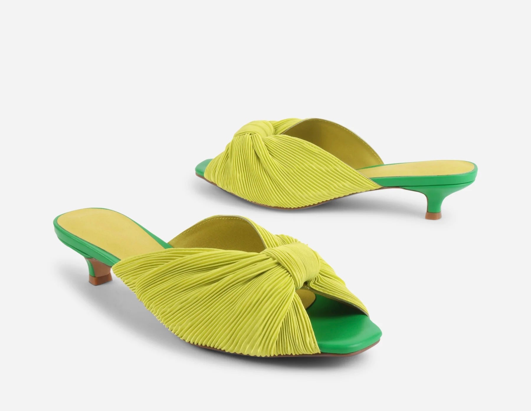 Yellow pleated kitten pen back sandal with a green heel pair front and back view