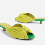 Yellow pleated kitten pen back sandal with a green heel pair front and back view