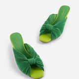 Green pleated kitten heel with open back pair from front top