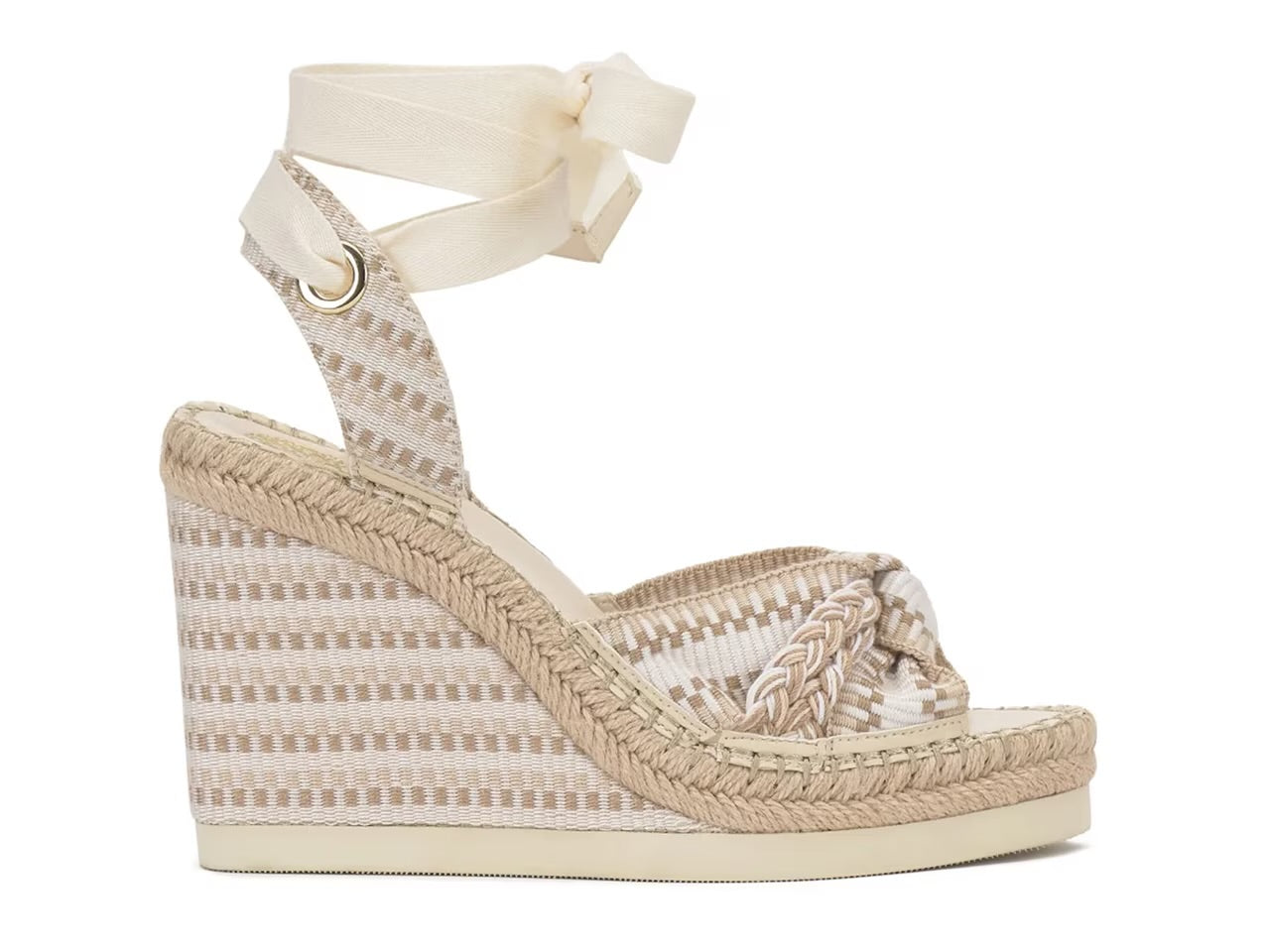 Woven wedge sandal with a bow on a white background