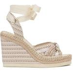 Woven wedge sandal with a bow on a white background
