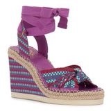 Colorful wedge sandal with a purple strap on a white background
