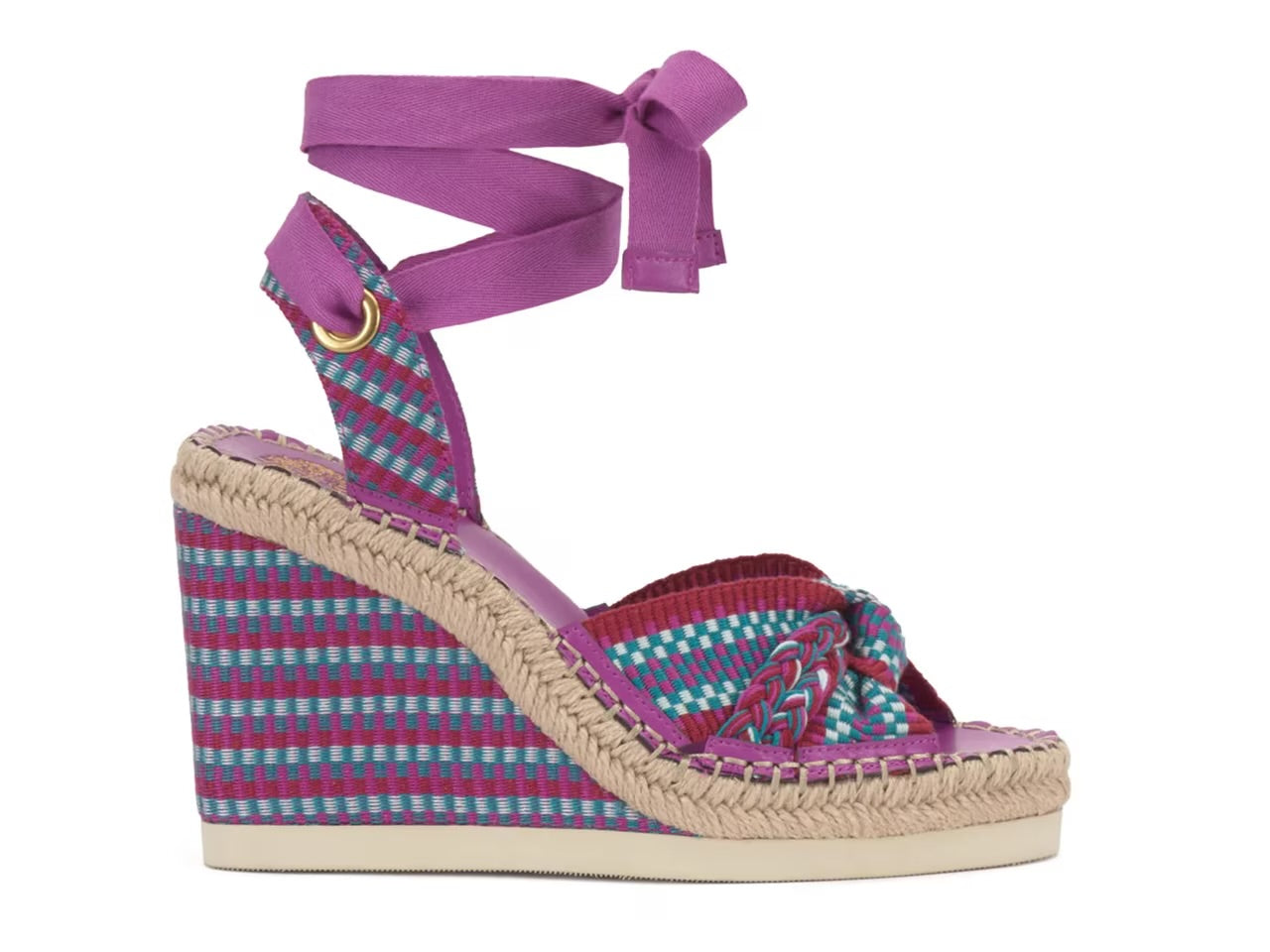 Woven wedge sandal with a purple strap on a white background