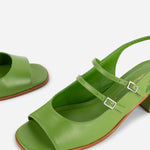 Green sandals with a strap on a white background