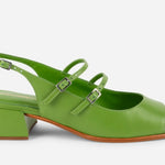 Green sandal with a block heel on a white background