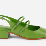 Green sandal with a block heel on a white background