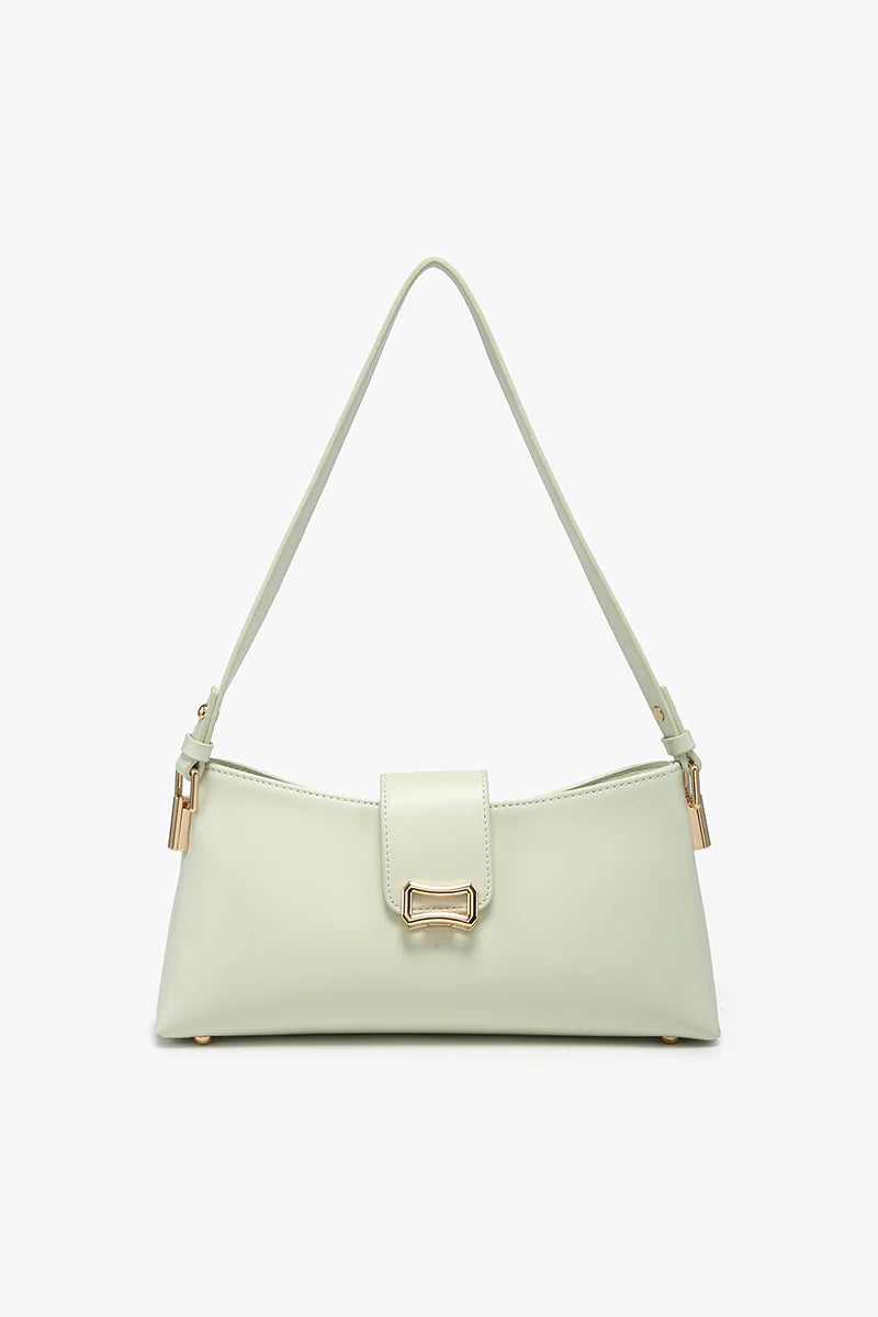 Light green handbag with a gold clasp close-up