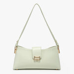Light green handbag with a gold clasp close-up