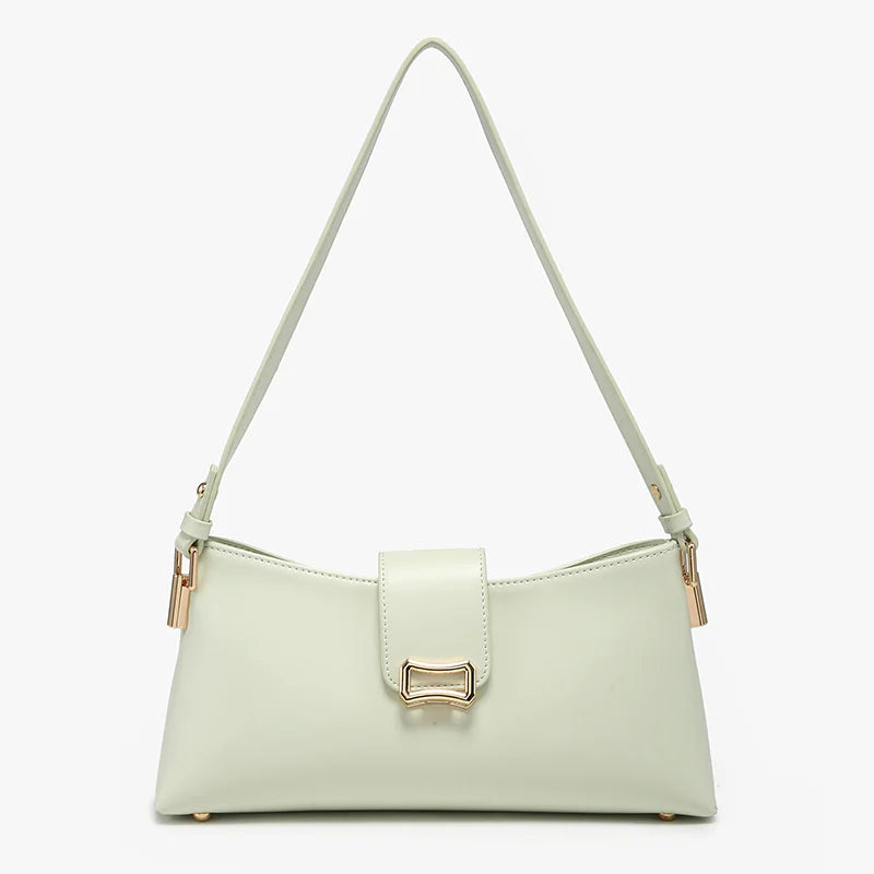 Light green handbag with a gold clasp close-up