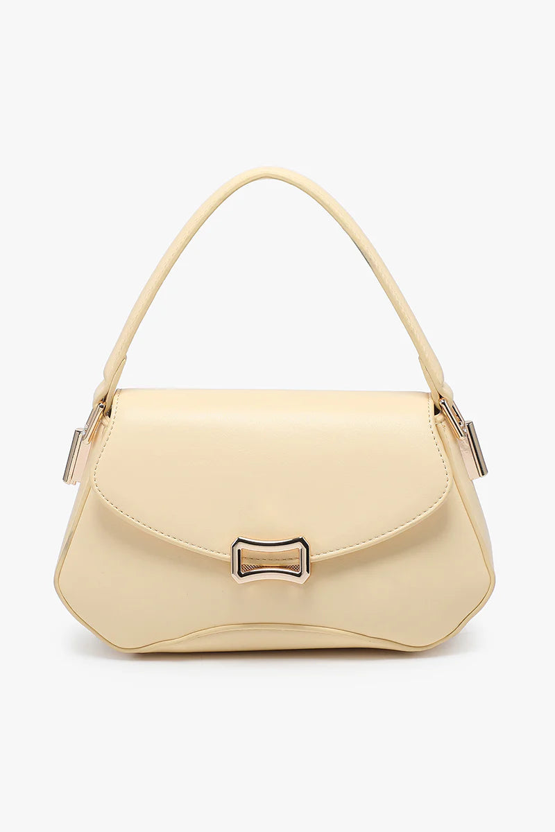 Beige handbag with a gold clasp close-up