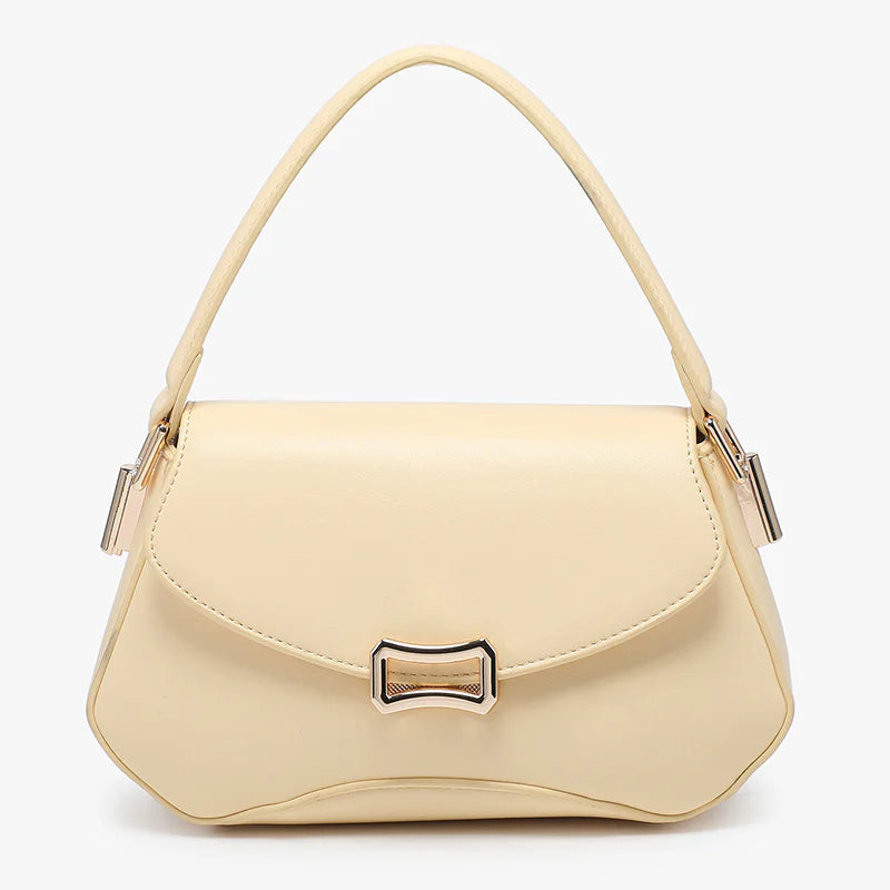 Beige handbag with a gold clasp close-up