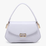 Lavender handbag with gold accents close-up