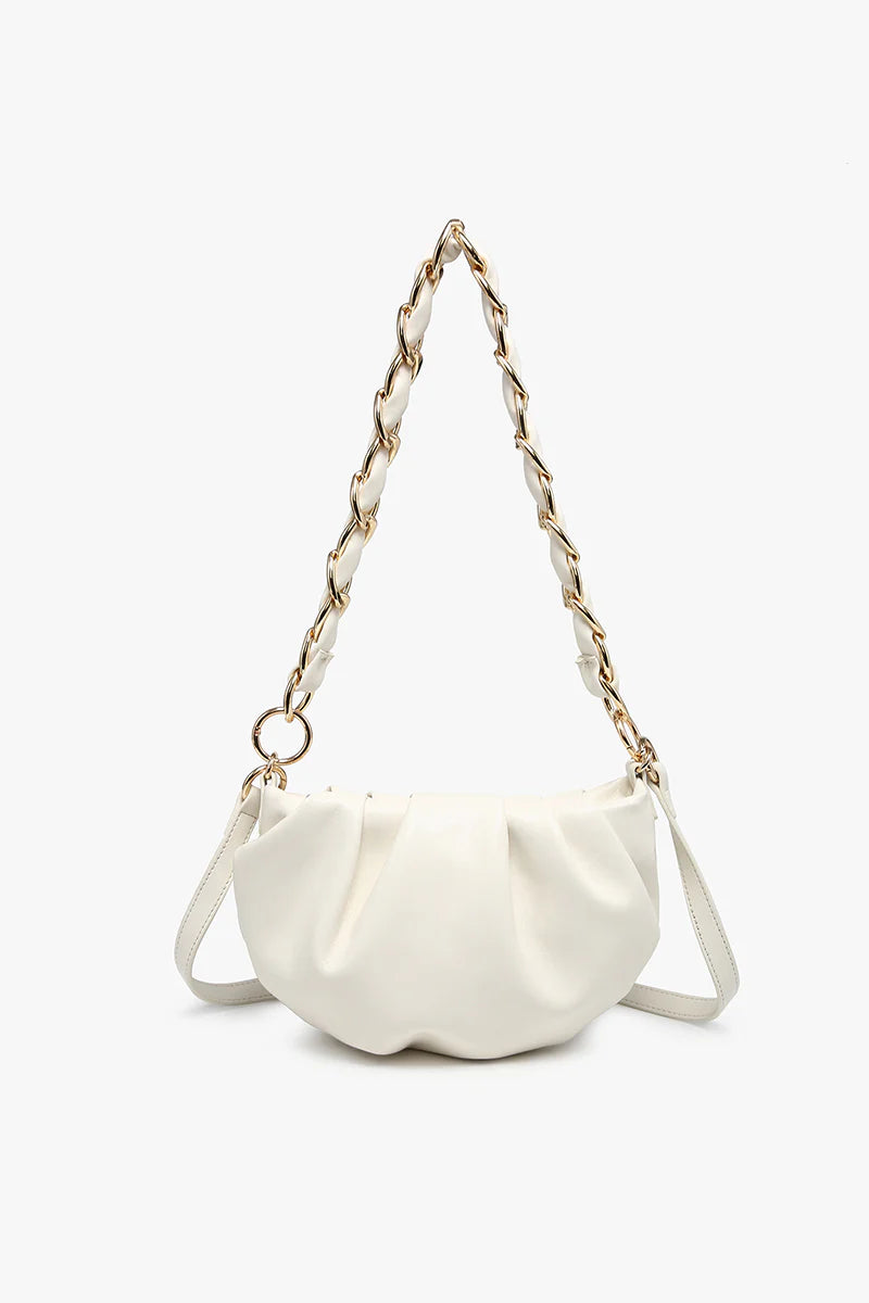 White handbag with a chain strap close-up
