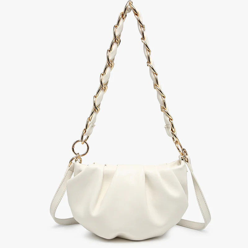 White handbag with a chain strap close-up